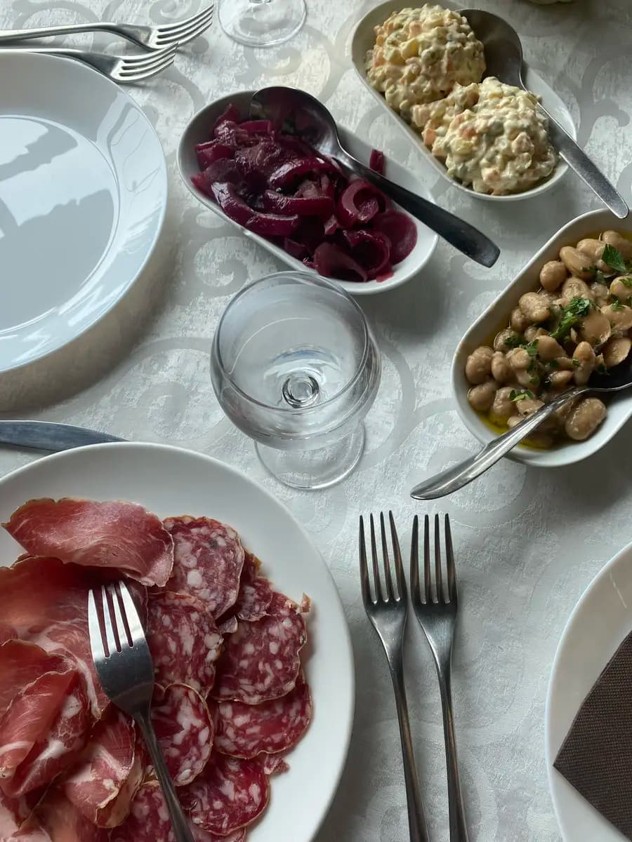 cold meats, cheese and farm food on the table in italy