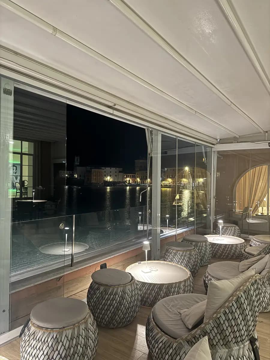 bar in miramare sestri levante with seats and tables facing out onto the bay