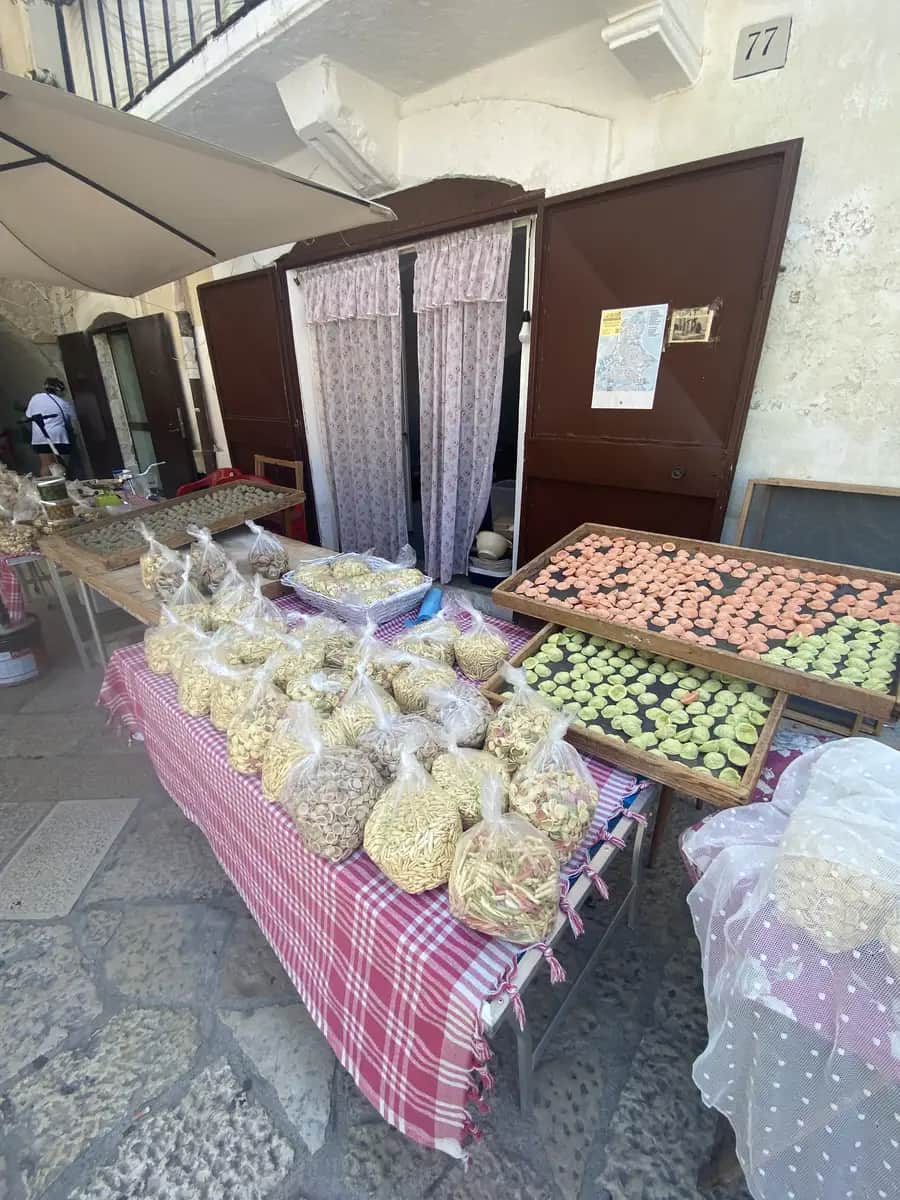 nonna's making pasta in the streets of bari italy