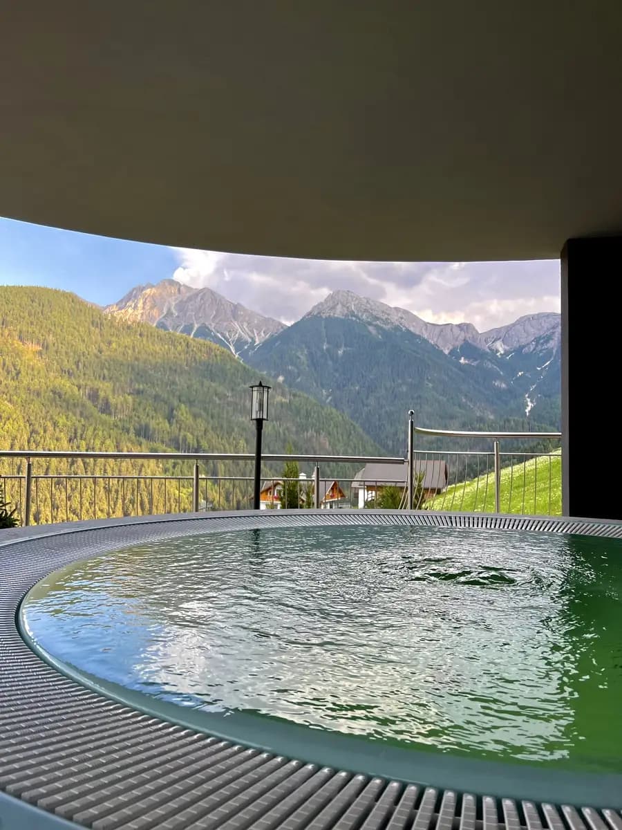 outdoor pool in the dolomites hotel looking out to the Kronplatz