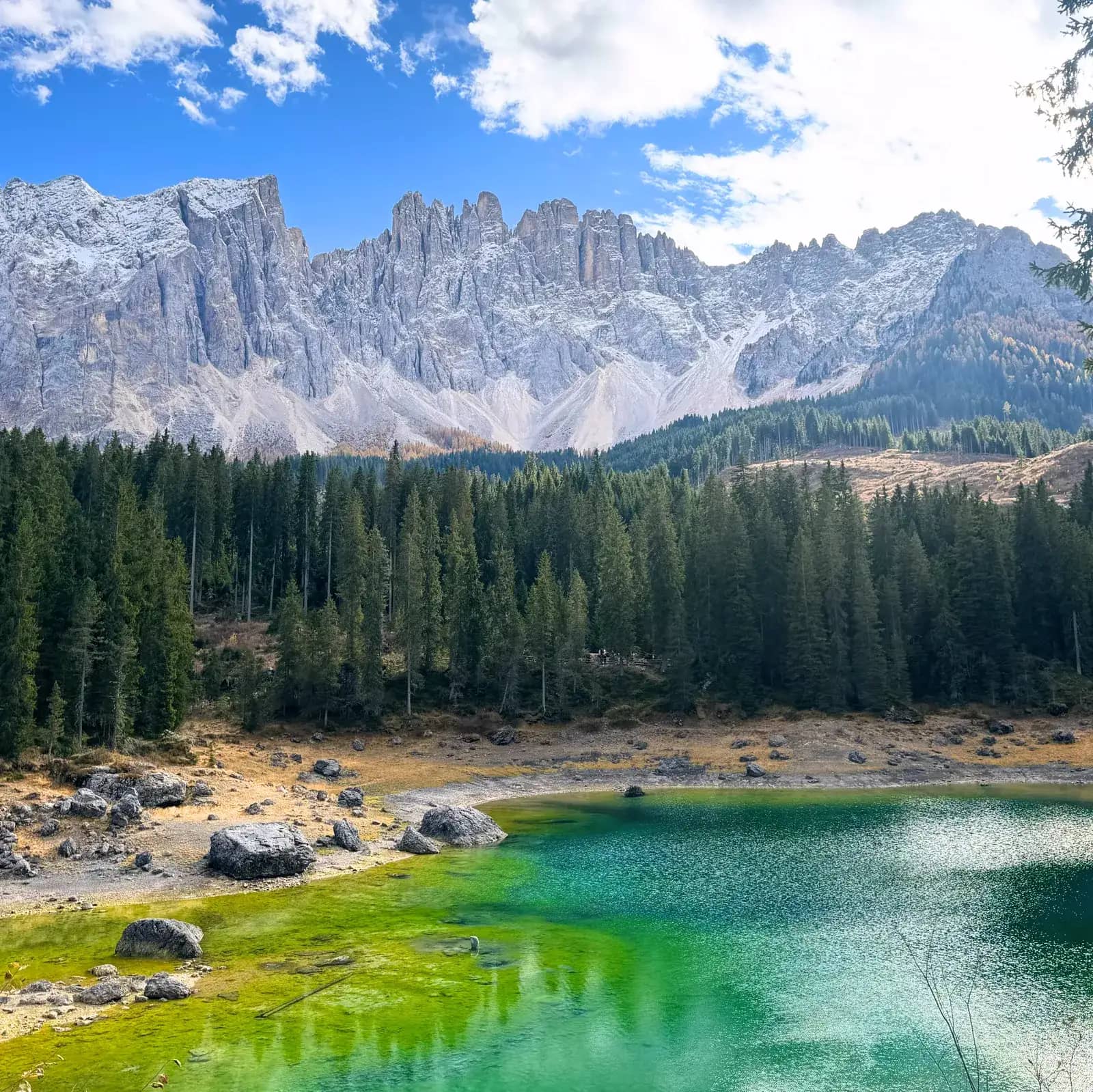 lago di carezza lake karersee dolomites with latemar mountains in the background