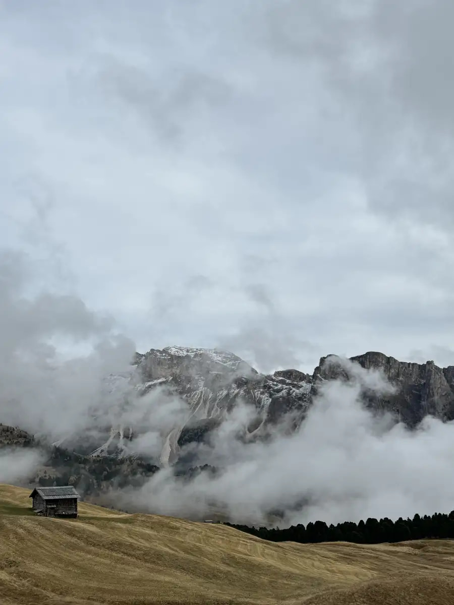 mountain hut above the clouds in seceda valley dolomites