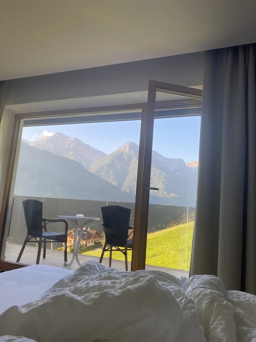 hotel in dolomites at kronplatz balcony looking out onto the mountains and ski lift