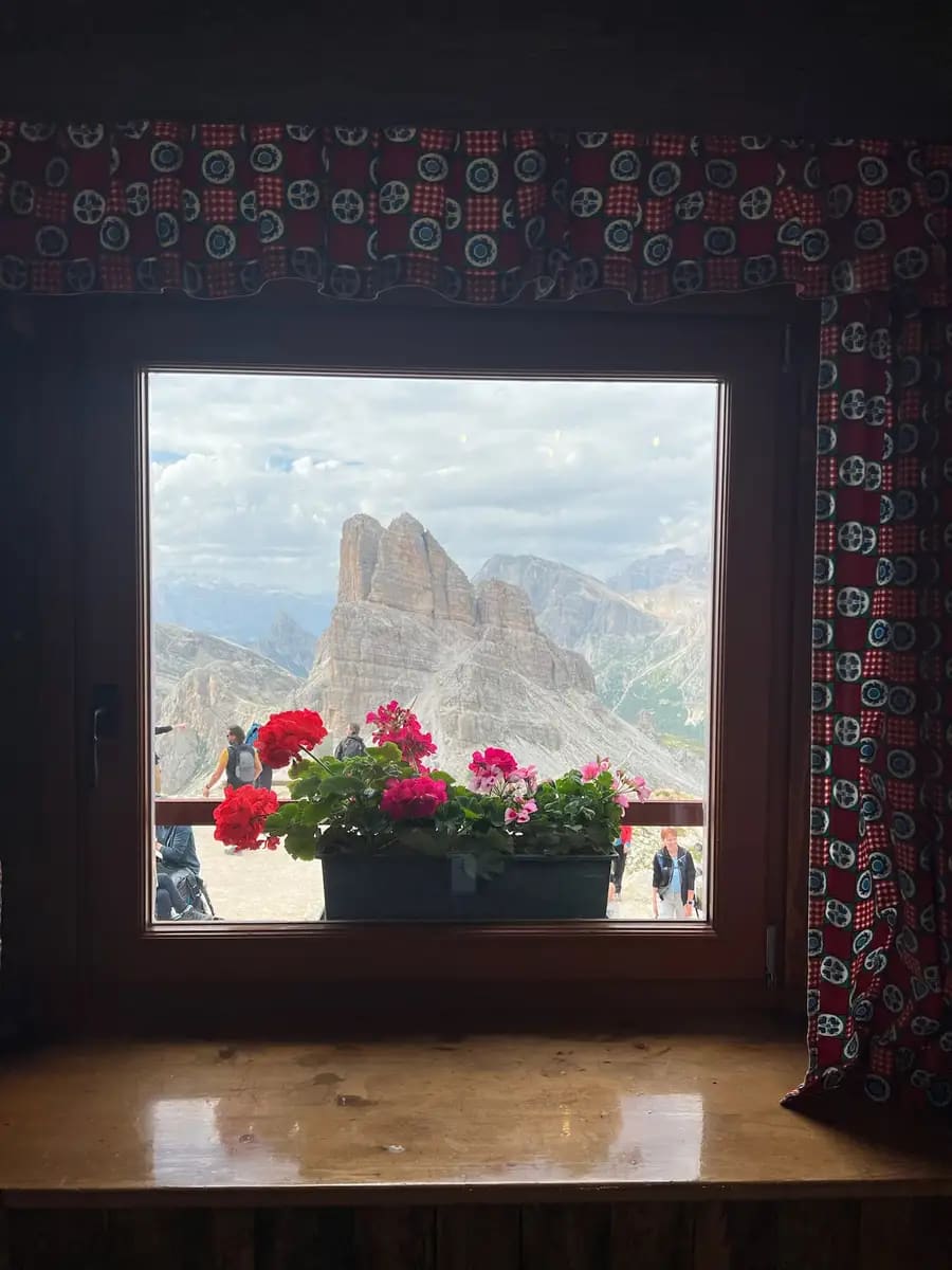 inside the rifugio nuvolau looking out at the peaks in val gardenia