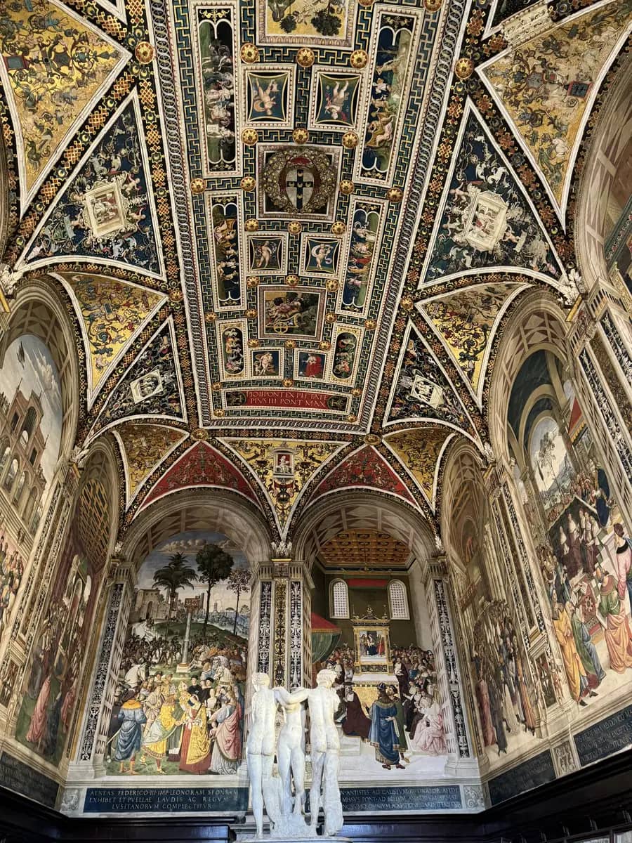 picture of sculptures and paintings inside the siena cathedral