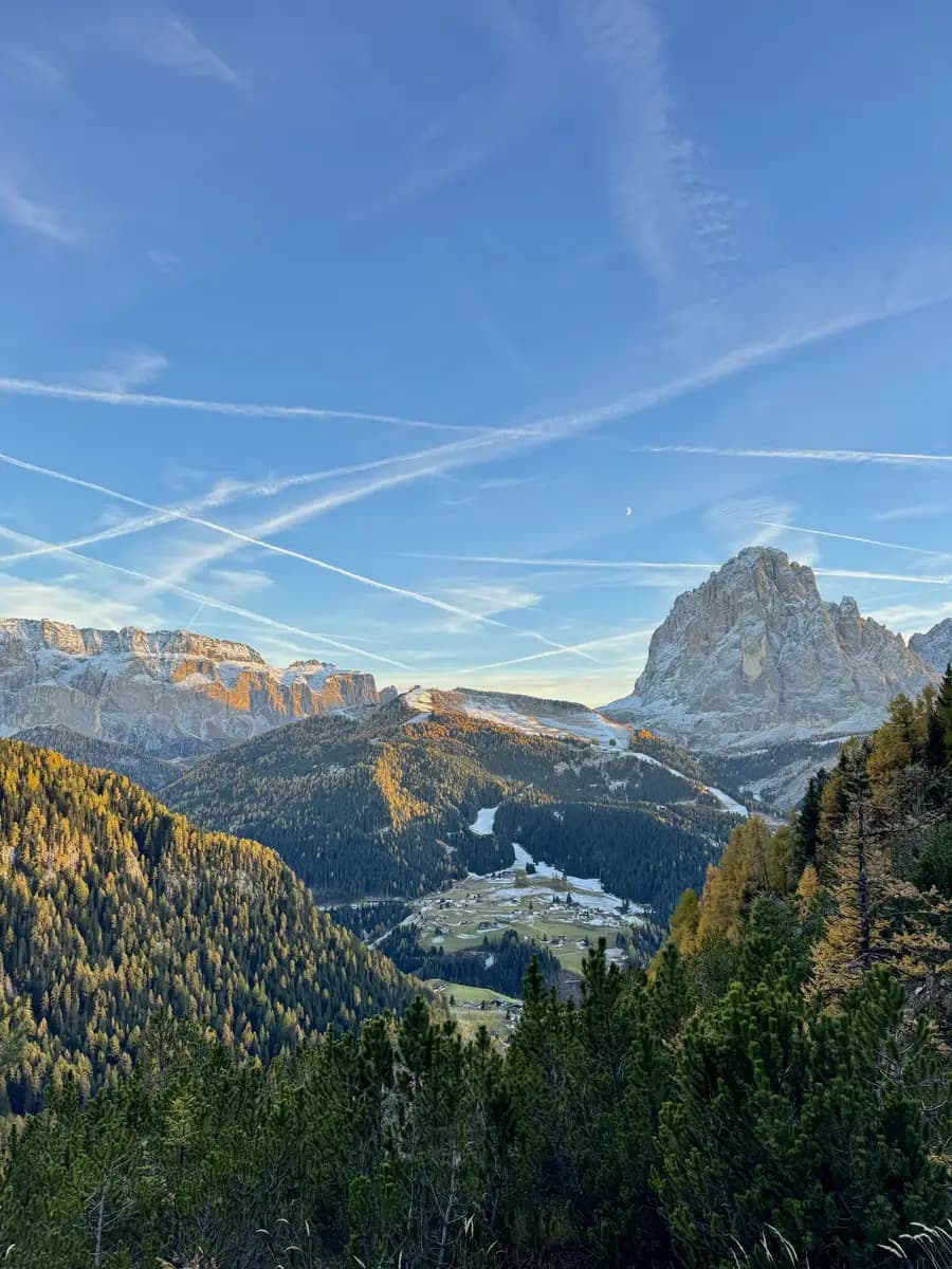 view of val gardena sella group mountain and sassolungo with autumn colours at sunset 