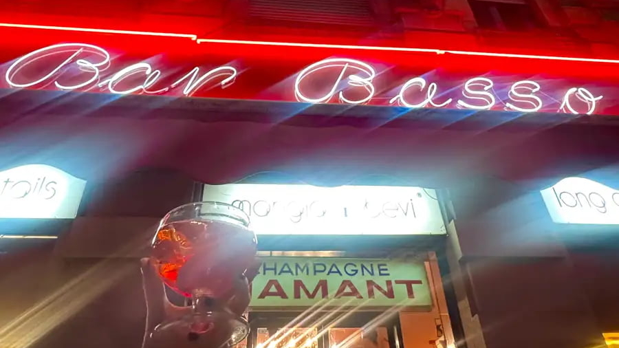 outside bar basso milano holding up a negroni sbagliato milan